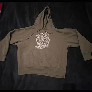 Green sweatshirt with a bison on the front